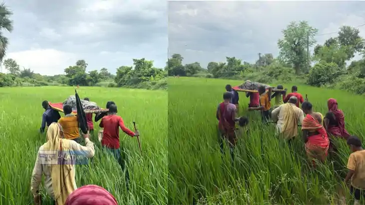 Wall Blocks Village Road Sick Man Carried Over Barrier in Bi