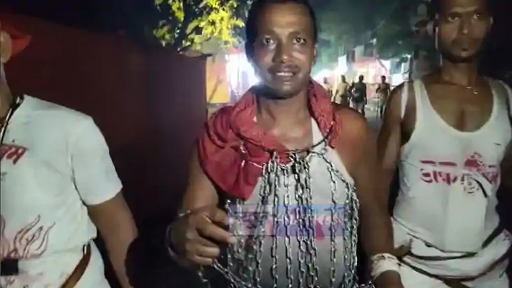 Devotee Walks Chained to Baidyanath Dham in Unique Shiva Vow