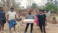 father carries dead newborn in box