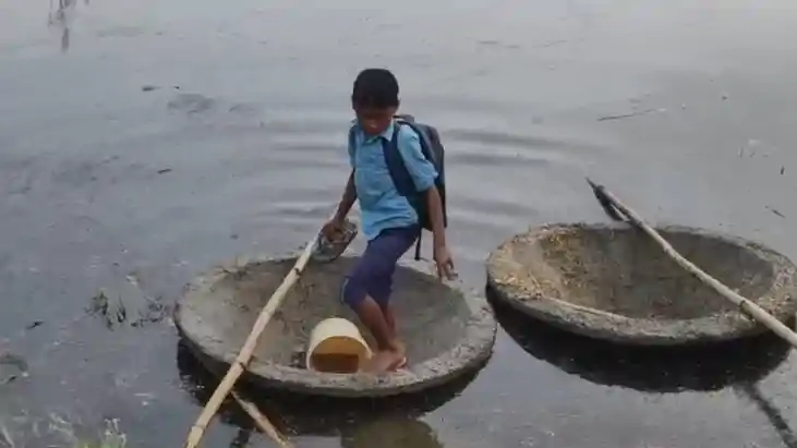 Flood Forces Two Brothers to Use Trough as Boat for School