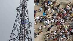 A young woman climbed a mobile tower demanding marriage